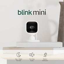 Load image into Gallery viewer, Blink Mini – Compact indoor plug-in smart security camera, 1080p HD video, night vision, motion detection, two-way audio, easy set up, Works with Alexa – 2 cameras (White)