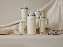 Load image into Gallery viewer, Stanley Quencher H2.0 FlowState Stainless Steel Vacuum Insulated Tumbler with Lid and Straw for Water, Iced Tea or Coffee, Smoothie and More, Cream 2.0, 64oz