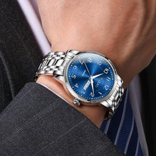 Load image into Gallery viewer, Taxau Blue Stainless Steel Band Watches for Men with Day Date Silver Large Face Watch Quartz Arabic Numerals Dress Analog Classic Waterproof Relojes para Hombres