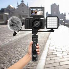 Load image into Gallery viewer, Minolta 64MP 4K60FPS VLOG Camera Kit Digital Autofocus Camcorder with Tripod, Remote, Mic, LED Light, 3-inch LCD Screen, Time-Lapse, Slow Motion, Wide Angle Lens, 32GB Card, USB, Black_566