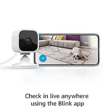 Load image into Gallery viewer, Blink Mini – Compact indoor plug-in smart security camera, 1080p HD video, night vision, motion detection, two-way audio, easy set up, Works with Alexa – 2 cameras (White)
