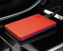 Load image into Gallery viewer, WD 6TB My Passport, Portable External Hard Drive, Red, Backup Software with Defense Against ransomware, and Password Protection, USB 3.1/USB 3.0 Compatible - WDBR9S0060BRD-WESN
