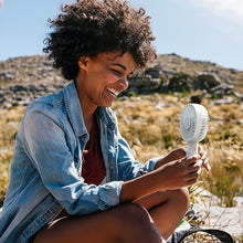 Load image into Gallery viewer, Pure Enrichment® PureBreeze™ Personal Handheld Fan with Base - 3 Fan Speeds, Built-In Rechargeable Lithium-Ion Battery, Lightweight Portable Design, Soothing Optional Aromatherapy Tank, USB Charger
