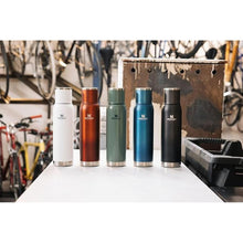 Load image into Gallery viewer, Stanley Adventure-to-Go Vacuum Bottle 1.4 qt | Wide Mouth with Leakproof Cup Lid | Keep Drinks Hot or Cold | Packable for Travel | Insulated Stainless Steel Thermos | BPA-Free | Hammertone Green
